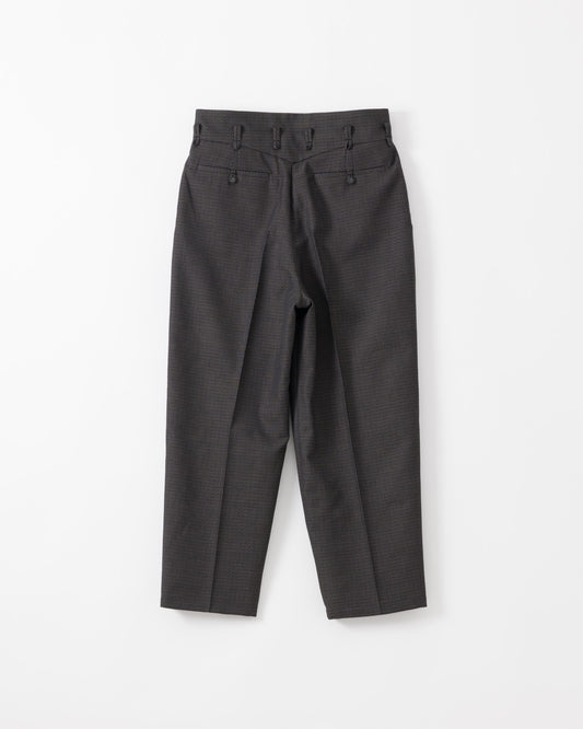 A pair of black trousers with a high waist, pleated front, and belt loops, laid flat against a white background.