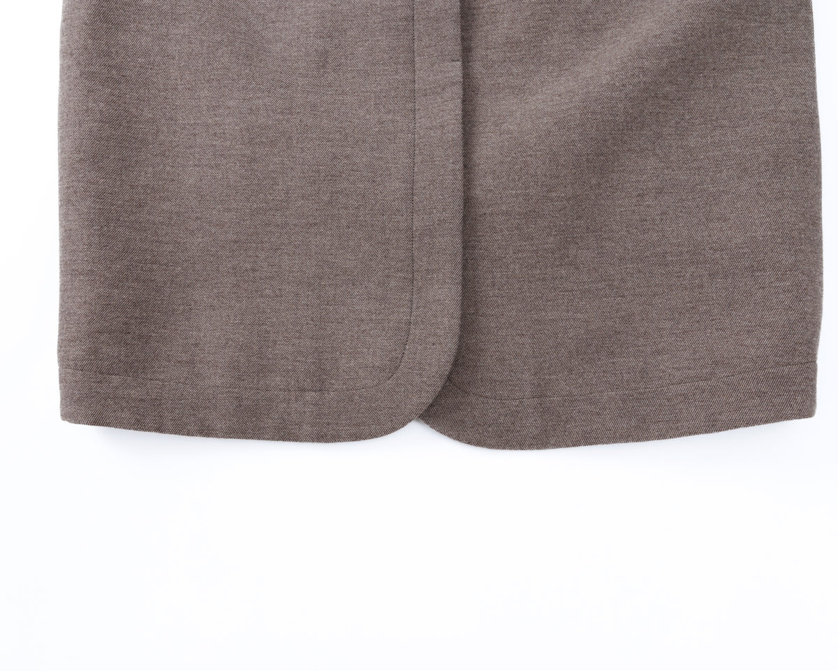 Close-up of taupe-brown coat on a white background