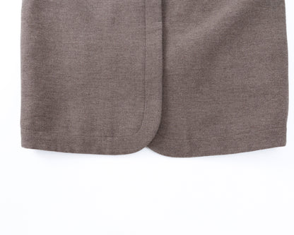 Close-up of taupe-brown coat on a white background