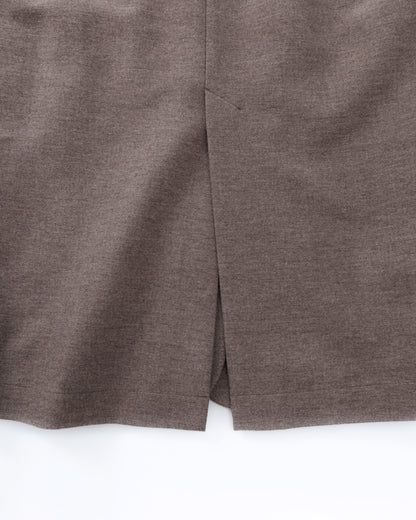 Close-up of a taupe-brown coat on a white background