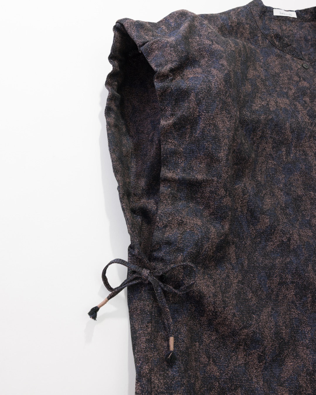 Dark floral patterned fabric on a white background