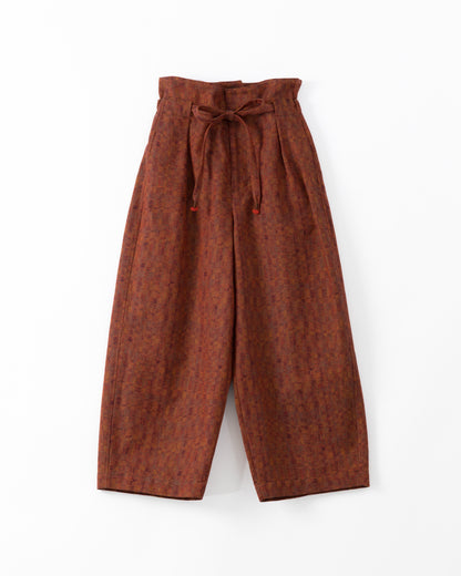 Red wide-leg trousers with a tie waist on a white background