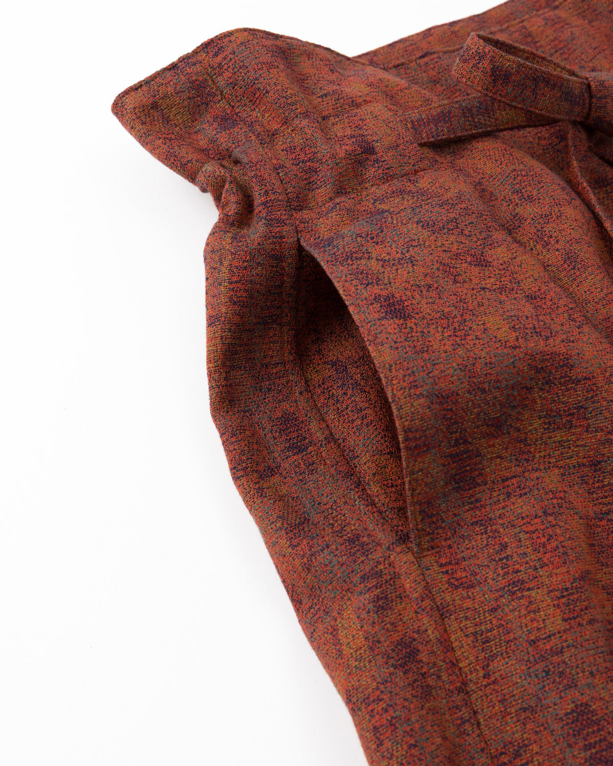 Close-up of a red textured fabric with a white background