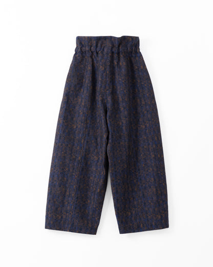 Navy blue patterned trousers on a white background