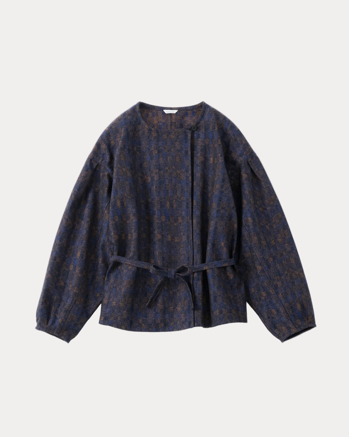 A dark navy blue cropped jacket with a subtle brown and gold abstract pattern, featuring balloon sleeves and a matching waist tie belt, shown against a light grey background.