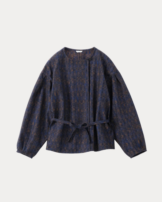 A dark navy blue cropped jacket with a subtle brown and gold abstract pattern, featuring balloon sleeves and a matching waist tie belt, shown against a light grey background.