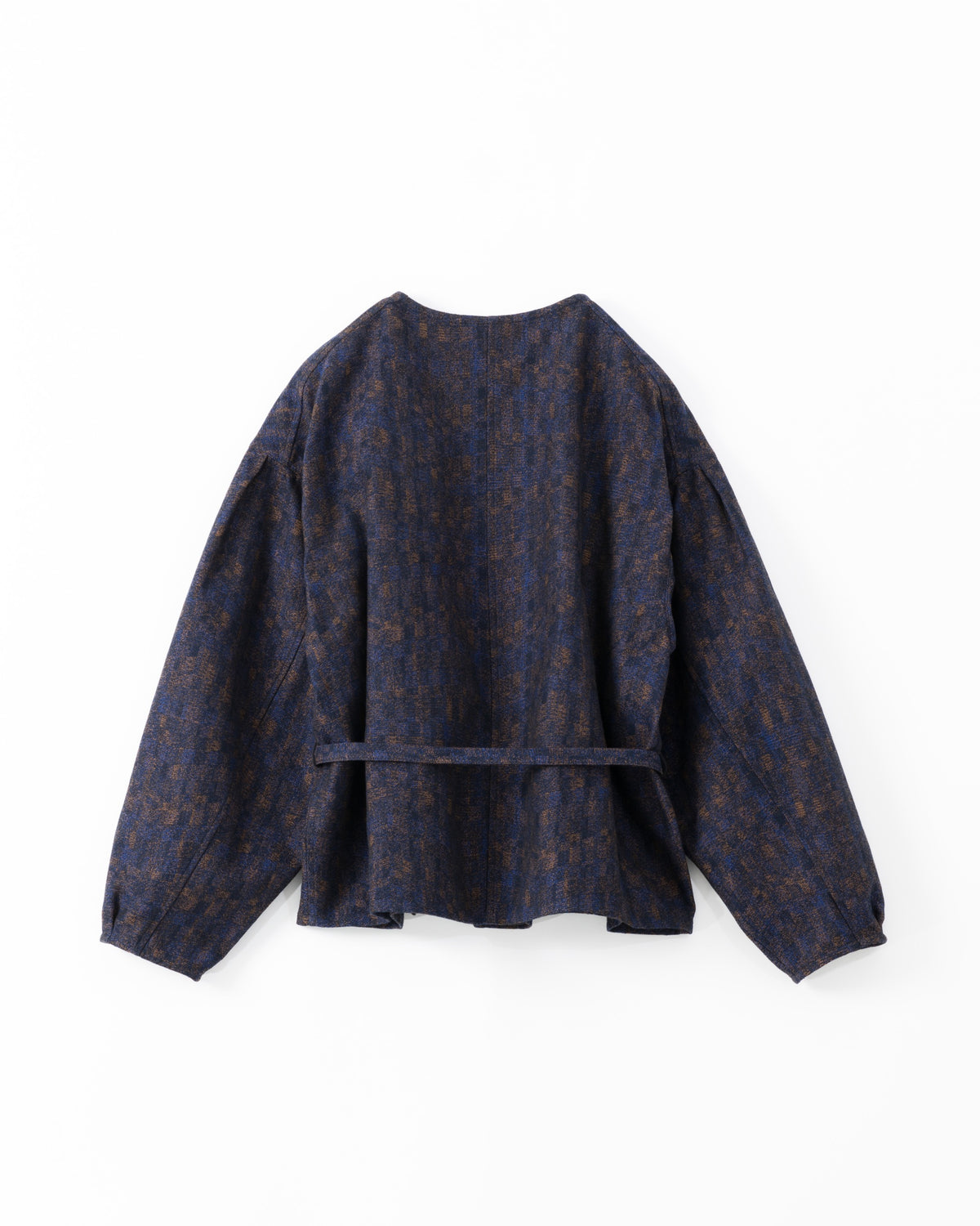 The back side of a dark navy blue cropped jacket with a subtle brown and gold abstract pattern, featuring balloon sleeves and a matching waist tie belt, shown against a light grey background.