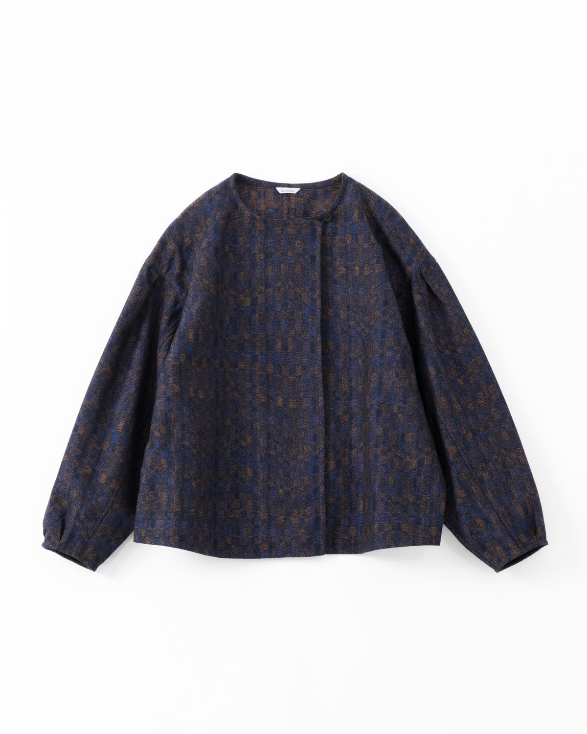 A dark navy blue cropped jacket with a subtle brown and gold abstract pattern, shown against a light grey background.