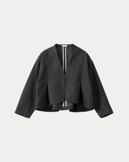 A black textured cropped jacket with long sleeves and a split V-neckline, featuring a vertical striped detail in beige and black down the centre front, displayed on a light grey background.