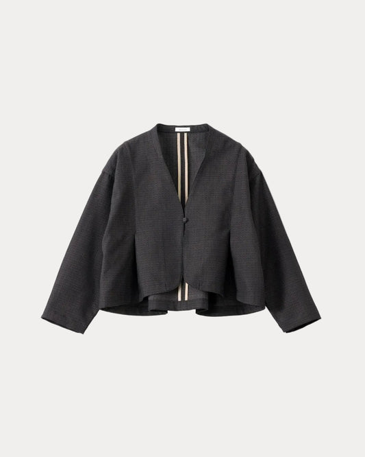 A black textured cropped jacket with long sleeves and a split V-neckline, featuring a vertical striped detail in beige and black down the centre front, displayed on a light grey background.