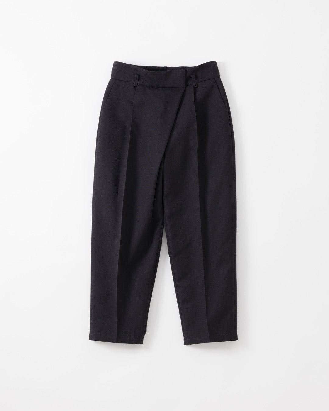 Black tailored trousers with a high waist, front pleats, and a wrap-style front closure, shown flat against a light gray background.