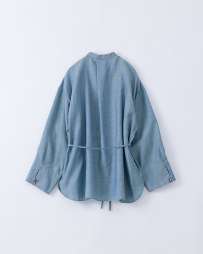A light blue long-sleeve cotton shirt with a tie belt at the waist, shown from the back against a plain white background.