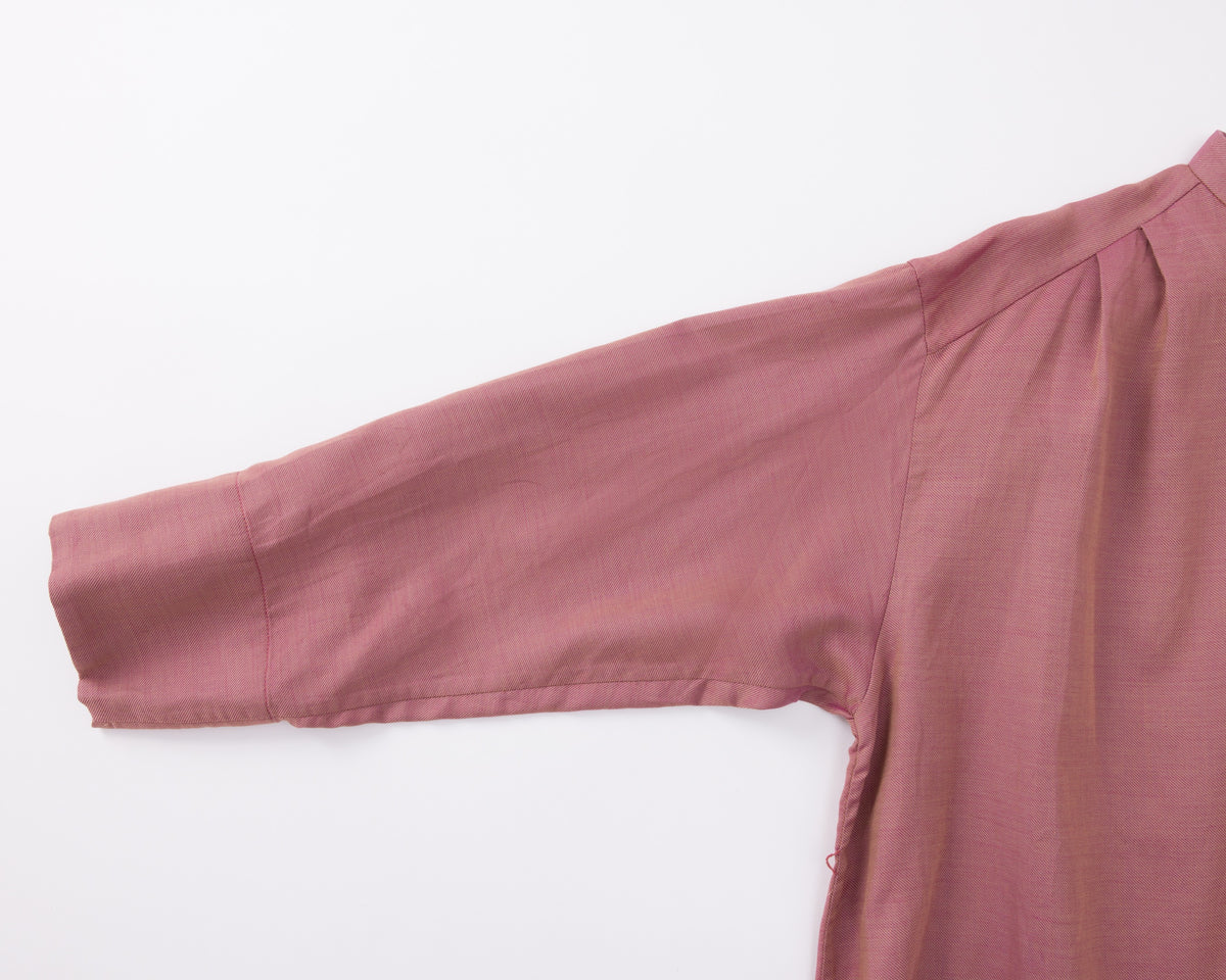 Pink long-sleeve shirt on a white background