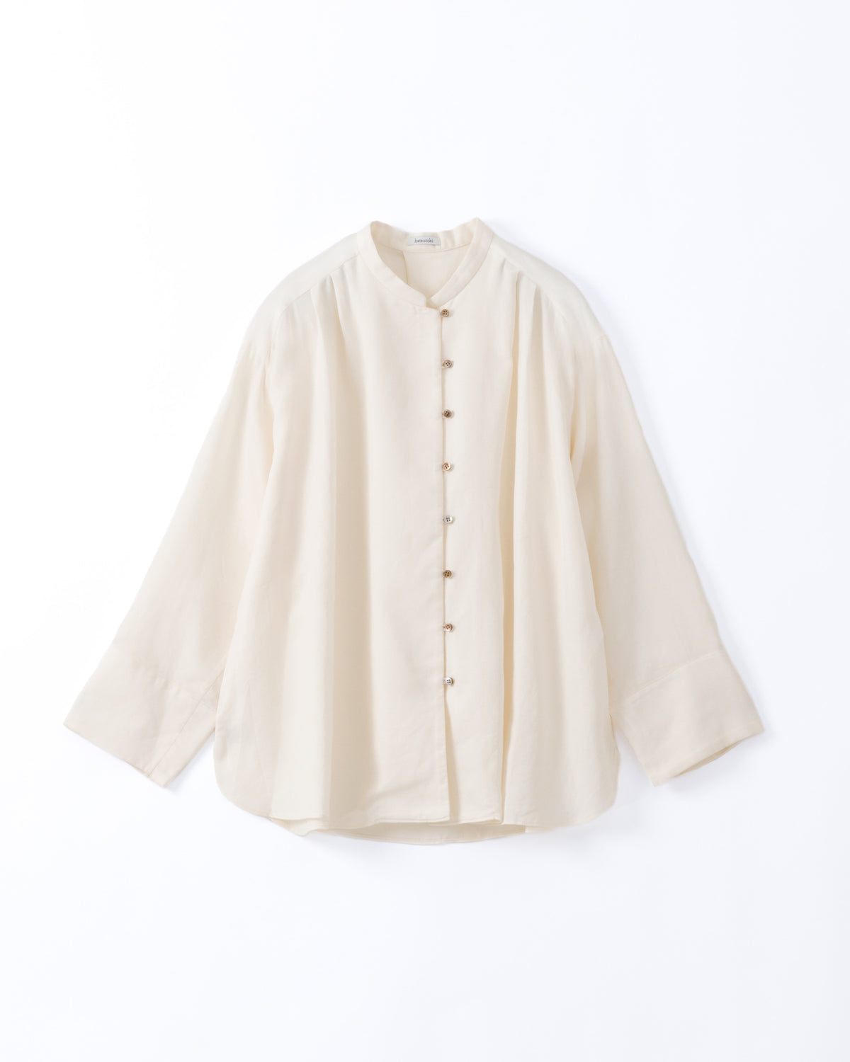 An off-white long-sleeve cotton shirt displayed against a white background.