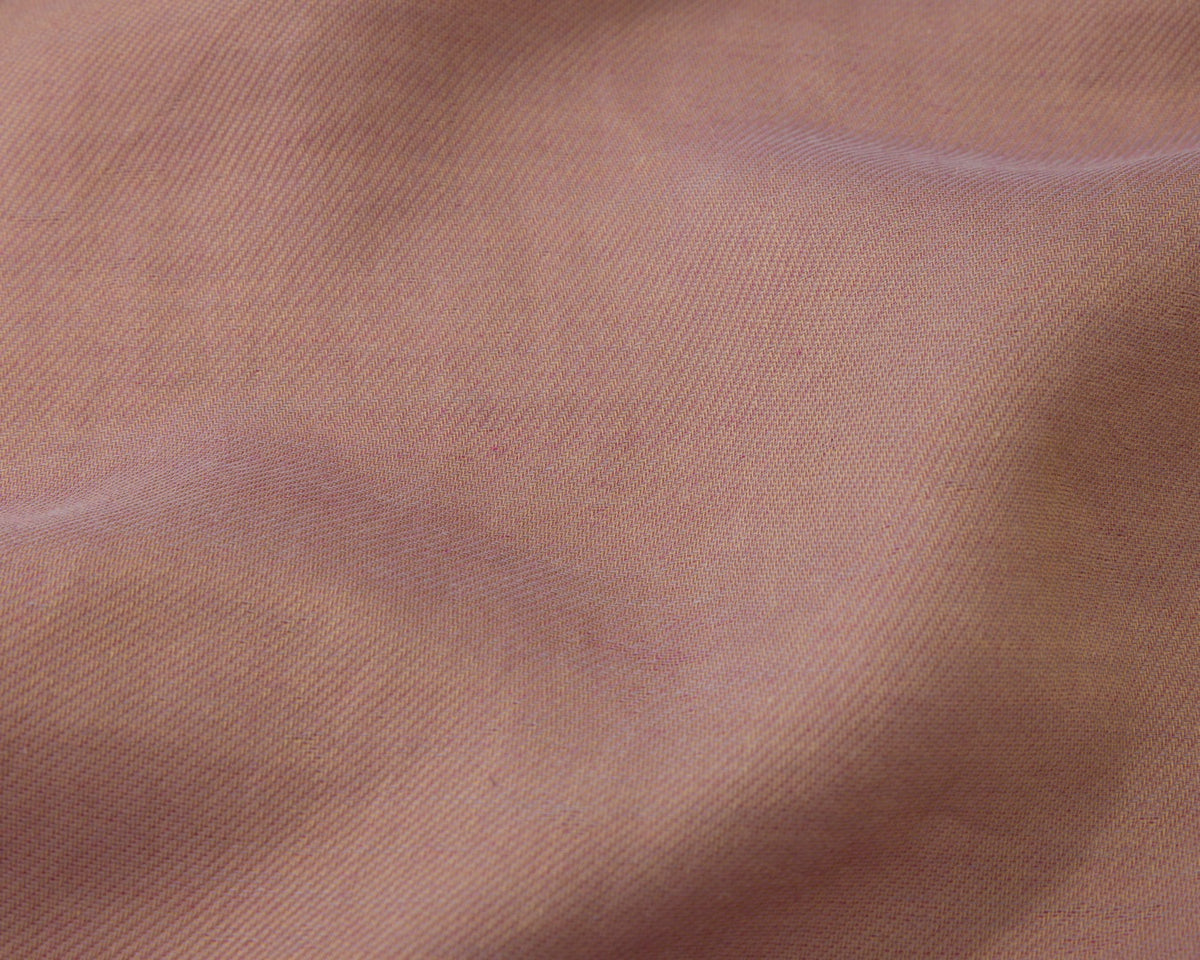 Close up of a dark pink textured fabric