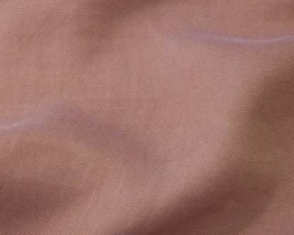 Close up of a dark pink textured fabric