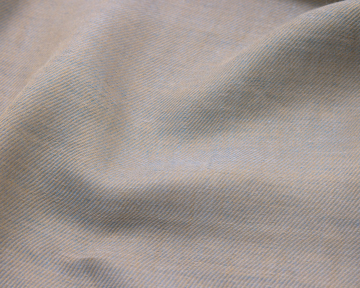 Close up of a grey textured fabric with blue accents