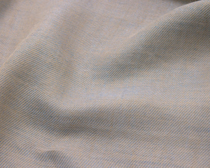 Close up of a grey textured fabric with blue accents