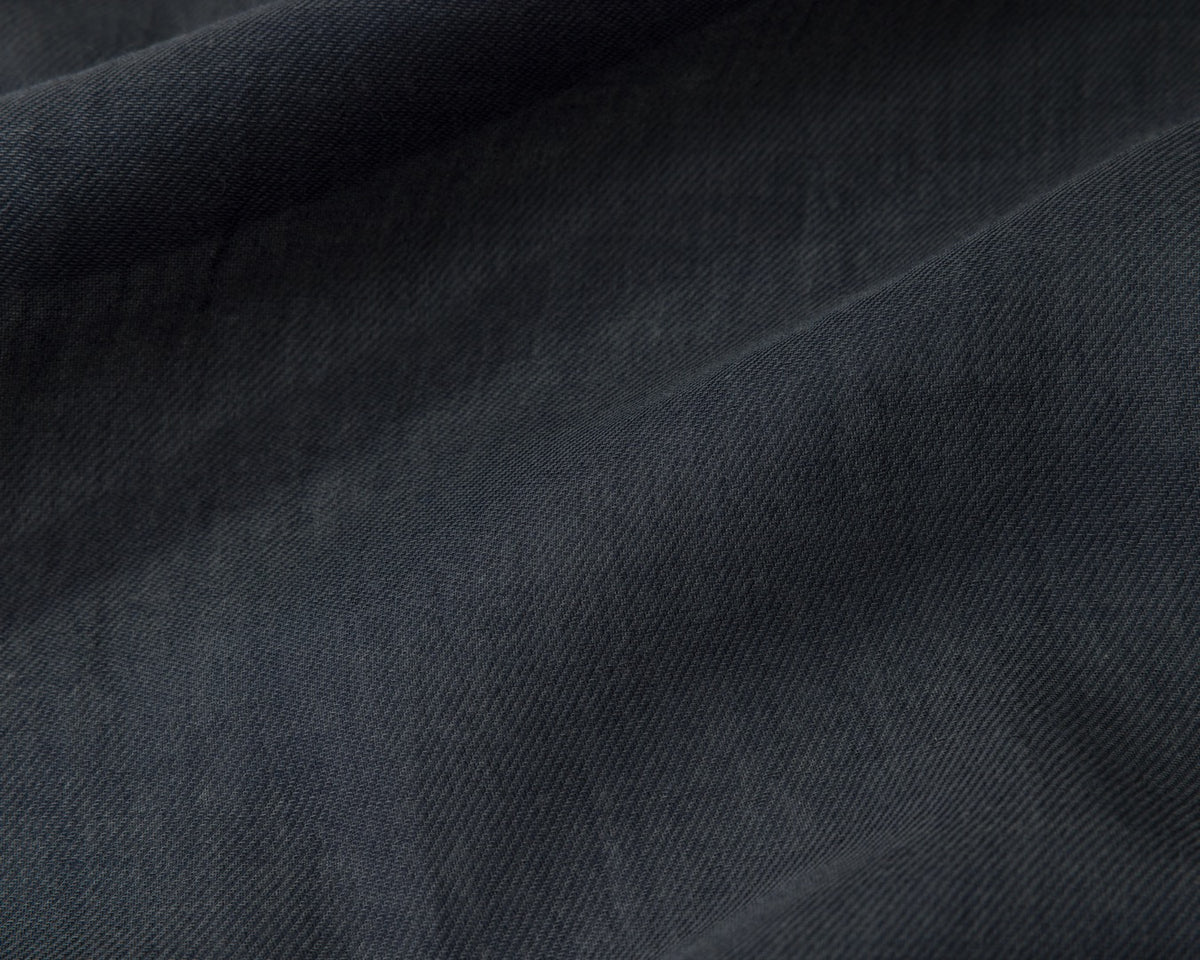 Close up of a navy textured fabric