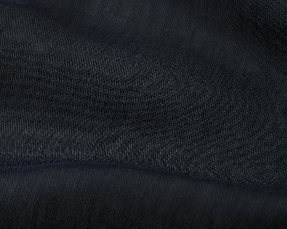 Close up of a navy textured fabric