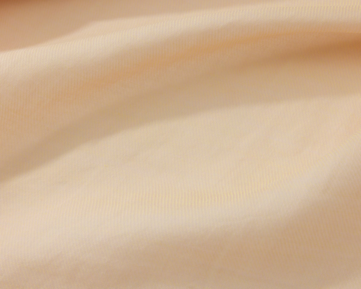 Close up of an orange textured fabric