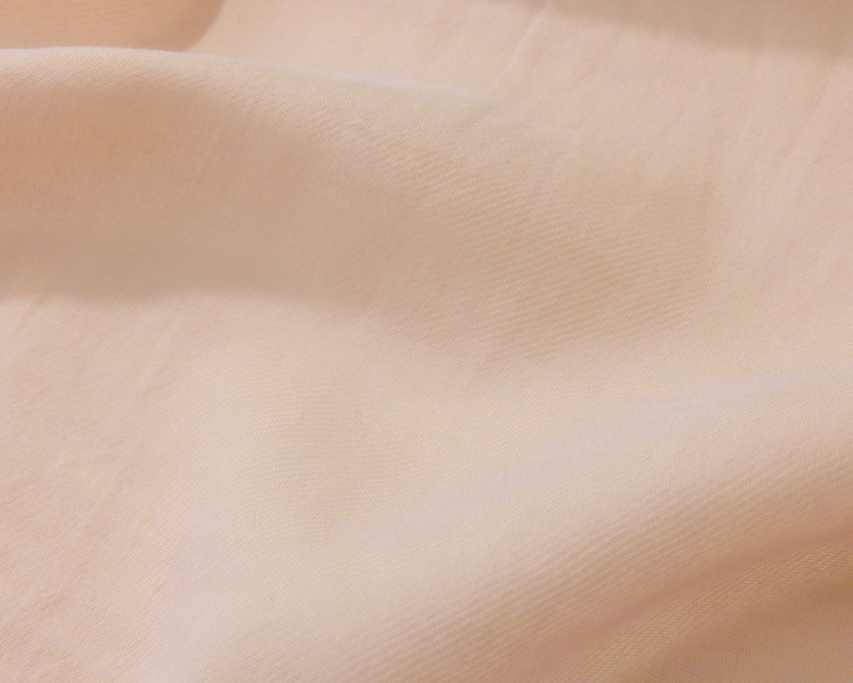 Close up of an orange textured fabric