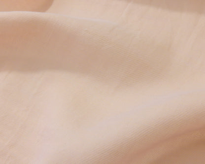 Close up of an orange textured fabric