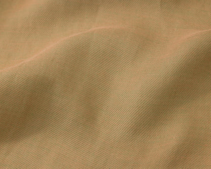 Close up of a pistachio green textured fabric