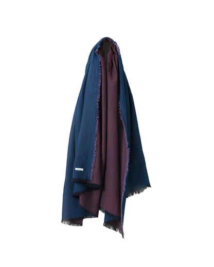 Blue and purple scarf draped over a white surface