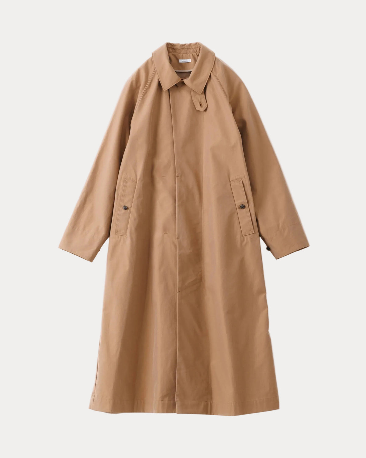 A mid-length tan car coat with a pointed collar, button front, and flap pockets, shown flat against a light gray background.