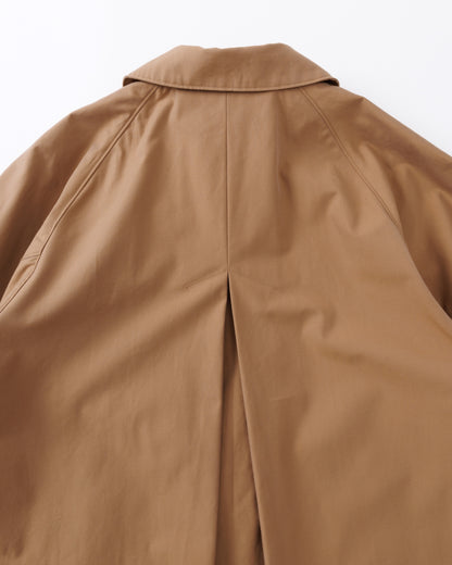 Close-up of a beige coat on a white background